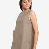 Left Detail of a Model wearing Beige Cotton Flax Kangaroo Pocket Dress