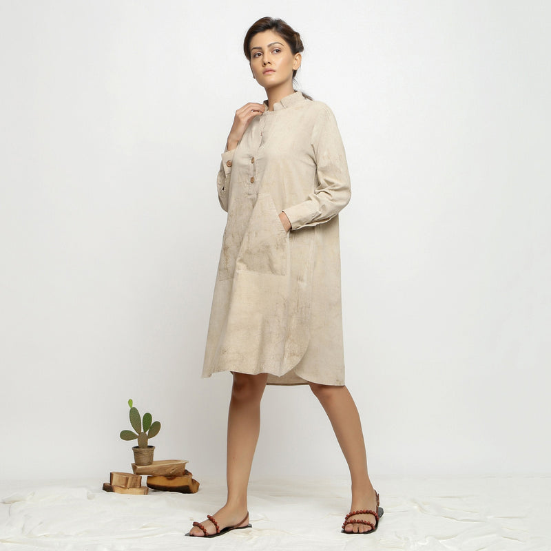 Left View of a Model wearing Beige Dabu Cotton Button-Down Dress