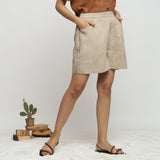 Right View of a Model wearing Beige Dabu Print Cotton Flared Shorts