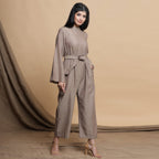 Right View of a Model wearing Beige Flared Sleeve Gathered Jumpsuit