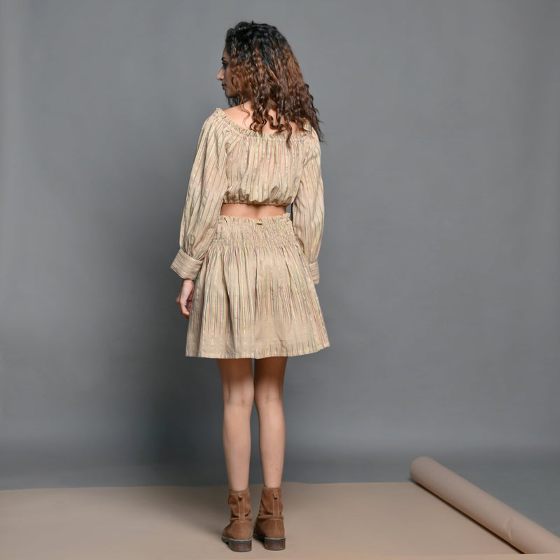 Back View of a Model wearing Beige Frilled Crop Top and Shirred Skirt set