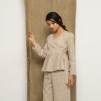 Left View of a Model wearing Beige Handspun Full Sleeve V-Neck Wrap Top