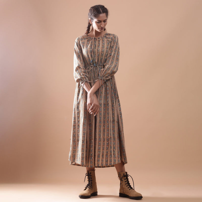 Front View of a Model wearing Beige Kalamkari Peasant Midi Dress