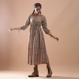 Front View of a Model wearing Beige Kalamkari Peasant Midi Dress