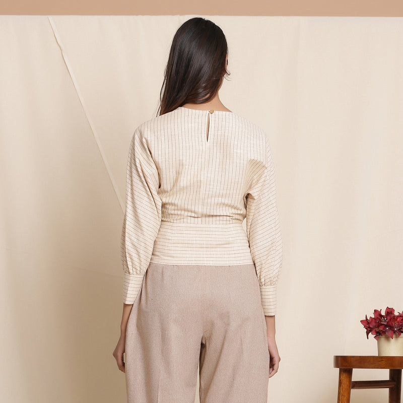 Back View of a Model wearing Beige Striped Surplice Blouson Top