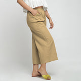 Right View of a Model wearing Beige Wide Legged Straight Pant