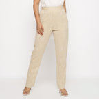 Front View of a Model wearing Beige Yarn Dyed Mid Rise Tapered Pant