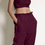 Front Detail of a Model wearing Warm Berrry Wine Frilled Straight Pant