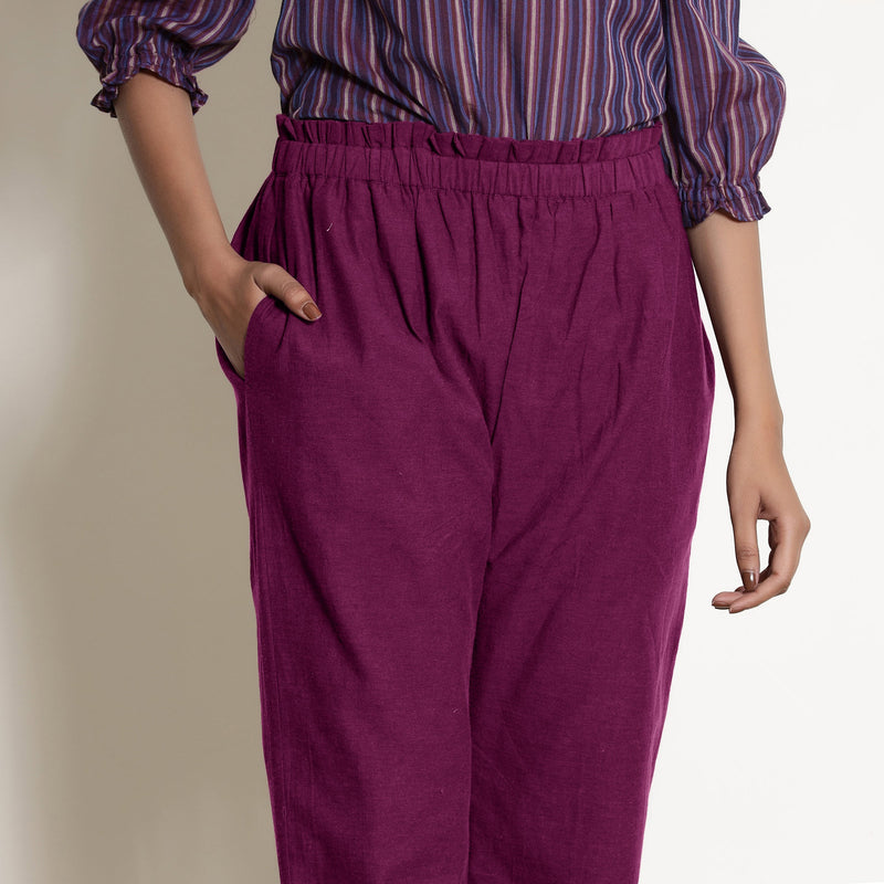 Front Detail of a Model wearing Warm Mulberry Frilled Waist Tapered Cotton Pant