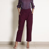 Front View of a Model wearing Warm Berry Wine Frilled Waist Tapered Pant