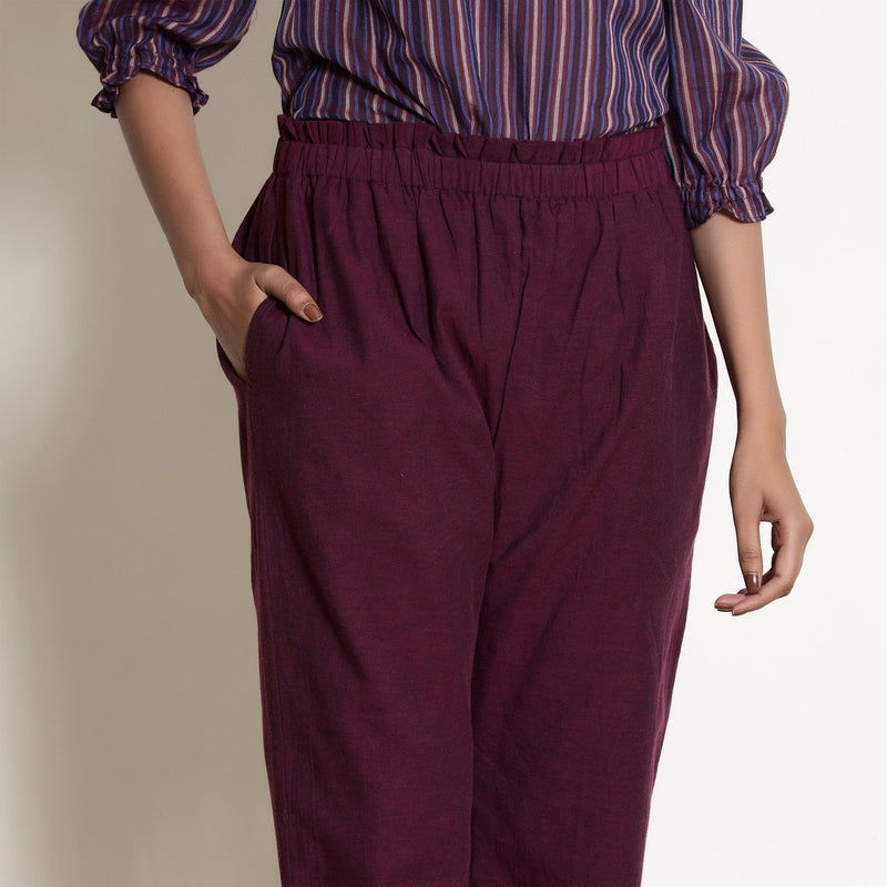 Front View of a Model wearing Warm Berry Wine Frilled Waist Tapered Pant