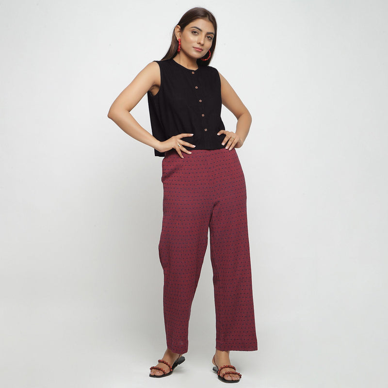 Front View of a Model wearing Black Button-Down Shirt and Polka Dot Pant Set