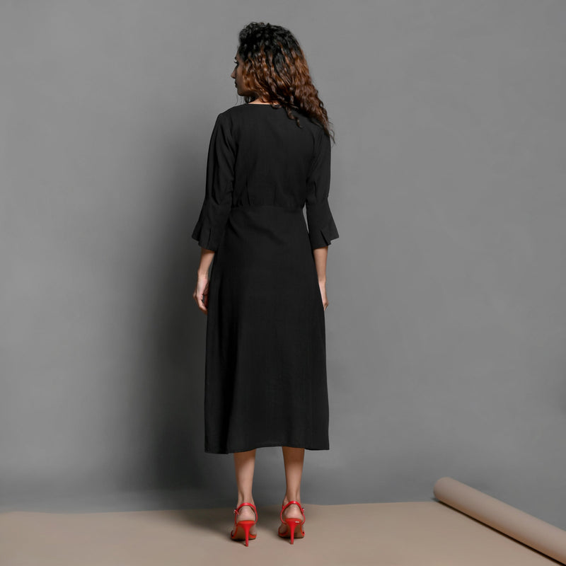 Back View of a Model wearing Black Handspun Cotton Pleated Midi Slit Dress
