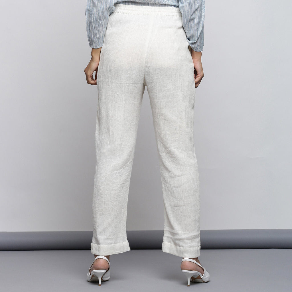 Back View of a Model wearing Off-White Crinkled Cotton Tapered Pant