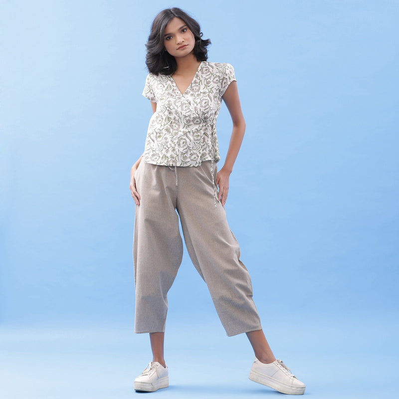 Front View of a Model wearing Block Printed Wrap Top and Beige Pant Set