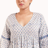 Front Detail of a Model wearing Blue Block Printed Bell Sleeves Tier Dress