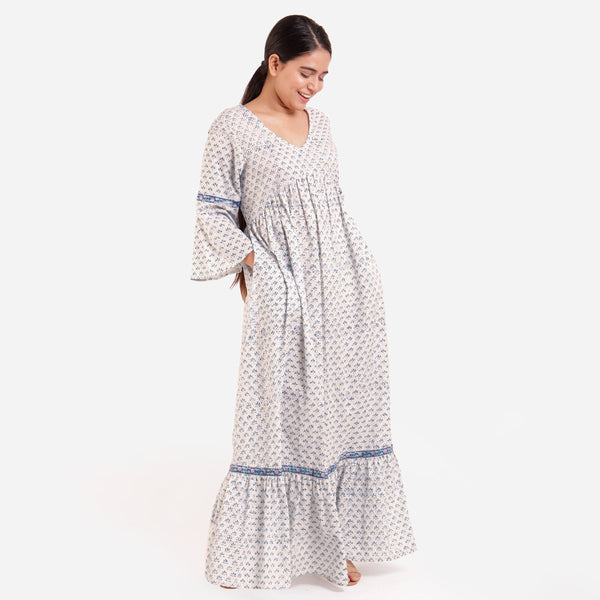 Right View of a Model wearing Blue Block Printed Bell Sleeves Tier Dress