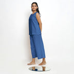 Left View of a Model wearing Blue Boat Neck Top and Powder Blue Pant Set