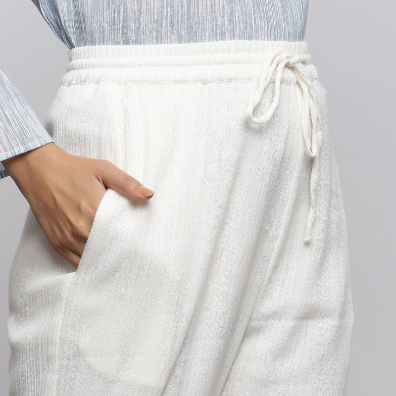 Right Detail of a Model wearing Off-White Crinkled Cotton Tapered Pant