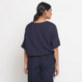 Back View of a Model wearing Solid Blue Cotton Flax Blouson Top