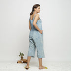 Back View of a Model wearing Blue Dabu Printed Button-Down Jumpsuit