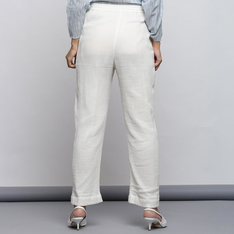 Back View of a Model wearing Off-White Crinkled Cotton Tapered Pant