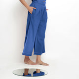 Right View of a Model wearing Powder Blue Vegetable Dyed Wide Legged Pant