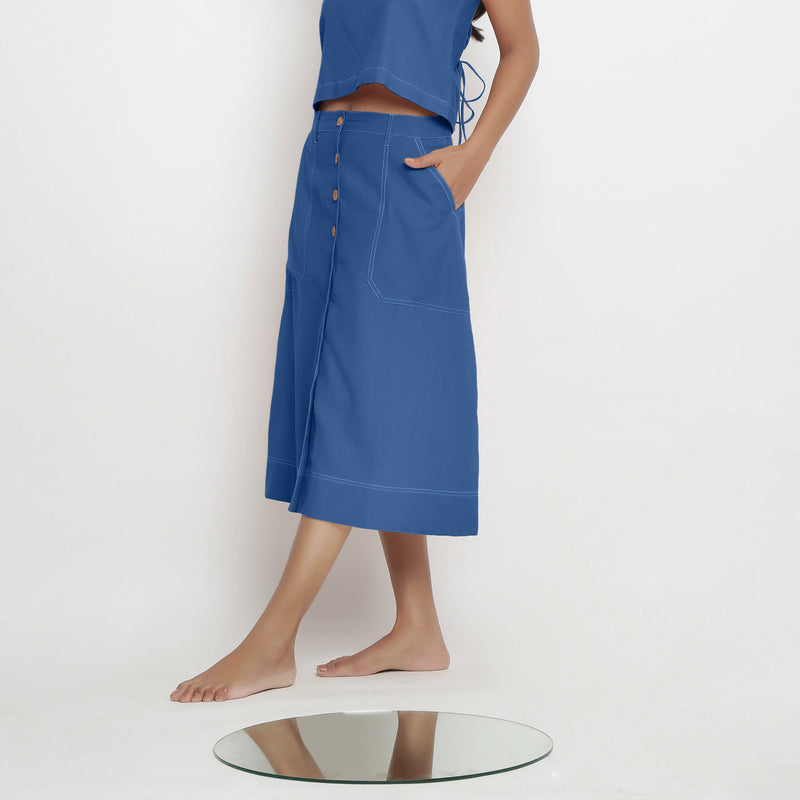 Left View of a Model wearing Powder Blue Vegetable Dyed Button-Down Skirt