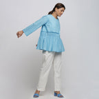 Right View of a Model wearing Blue Tie Dyed Anti-Fit Outerwear