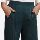 Front Detail of a Model wearing Bottle Green Mid Rise Straight Fit Pant