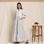 Left View of a Model wearing Breezy Cloudy Grey Striped Tier Dress