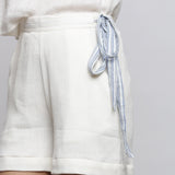 Front Detail of a Model wearing White Short Crinkled Cotton Shorts