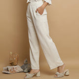 Left View of a Model wearing Undyed Elasticated Mid Rise Ecru Pant