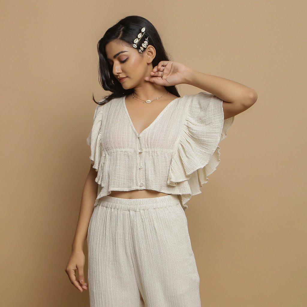 Front View of a Model wearing Breezy Undyed Crop Top and Ecru Pant Set