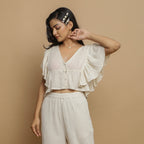 Front View of a Model wearing Breezy Undyed Crop Top and Ecru Pant Set