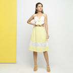 Front View of a Model wearing Lacy Yellow Tube Top and A-Line Skirt Set