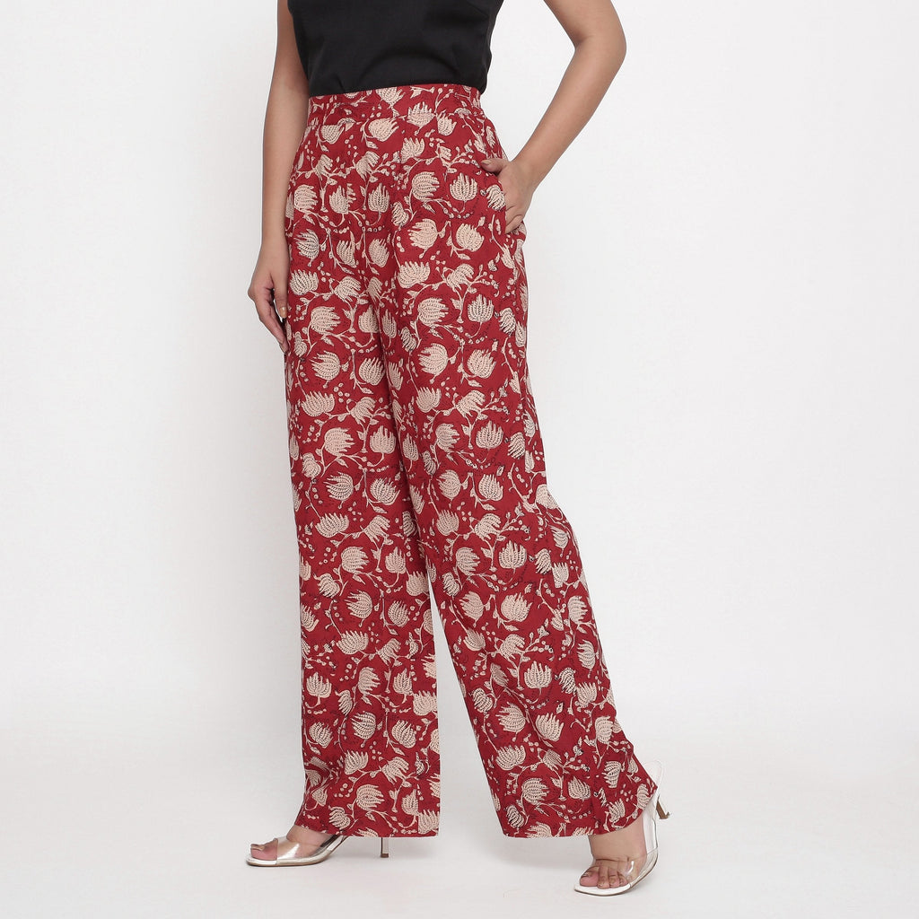 Left View of a Model wearing Brick Red Block Print Wide Legged Pant
