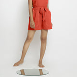 Front View of a Model wearing Brick Red Vegetable Dyed Handspun Short Shorts