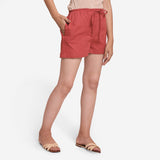 Right View of a Model wearing Brick Red Cotton Straight Shorts