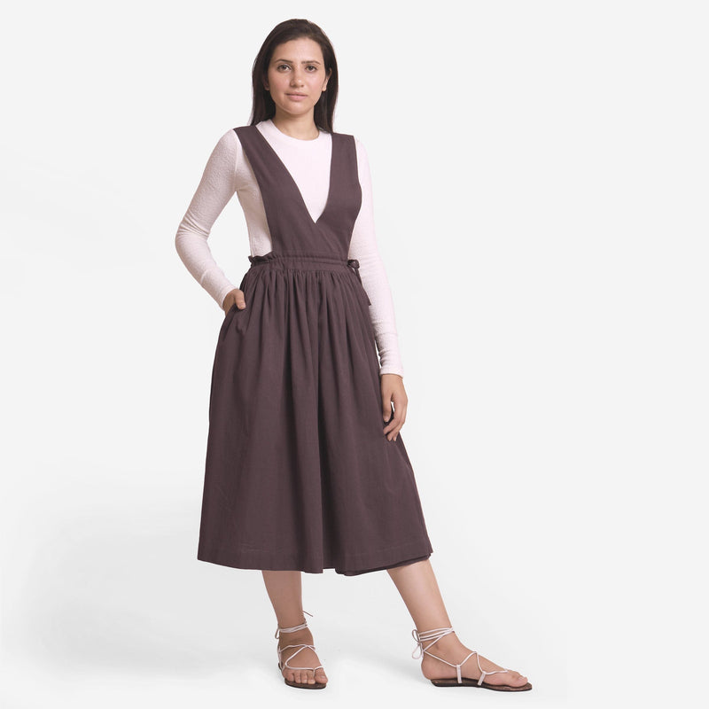 Front View of a Model wearing Brown Deep Neck Pinafore Midi Wrap Dress