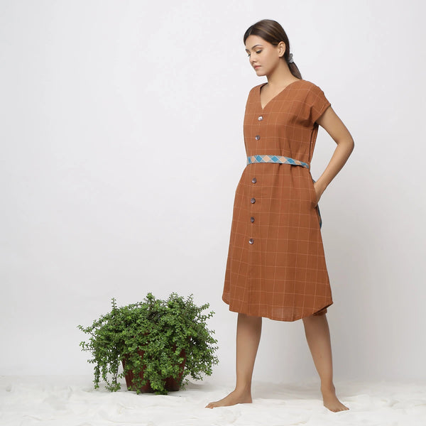 Left View of a Model wearing Brown Handspun V-Neck Shift Dress