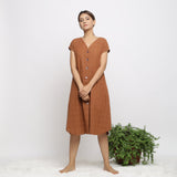 Front View of a Model wearing Brown Handspun V-Neck Shift Dress