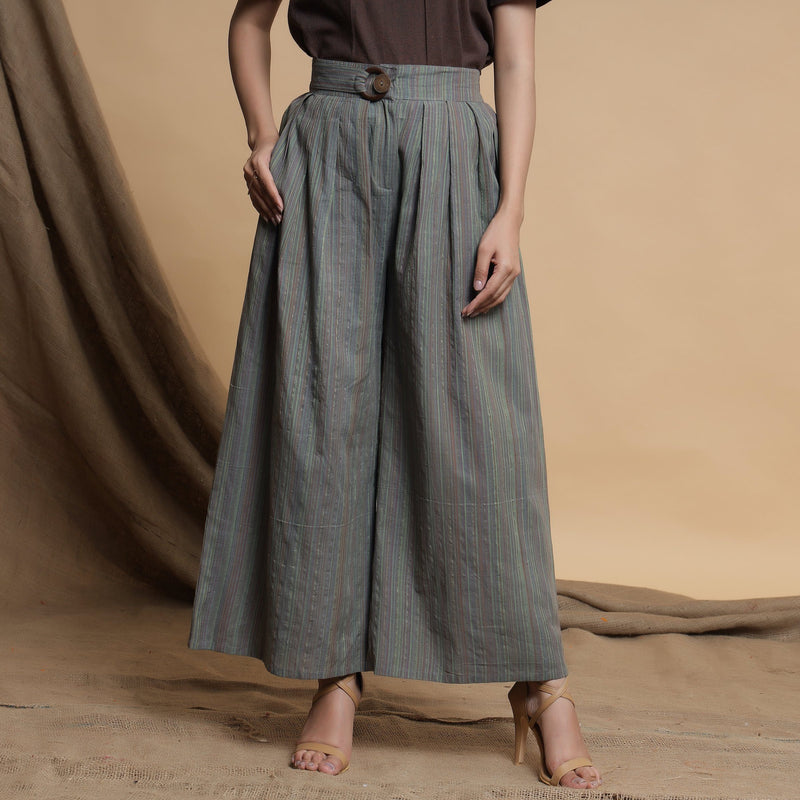Front View of a Model wearing Grey Striped Wide Legged Pleated Pant
