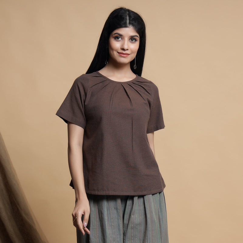 Front View of a Model wearing Brown Pleated Neck A-Line Top