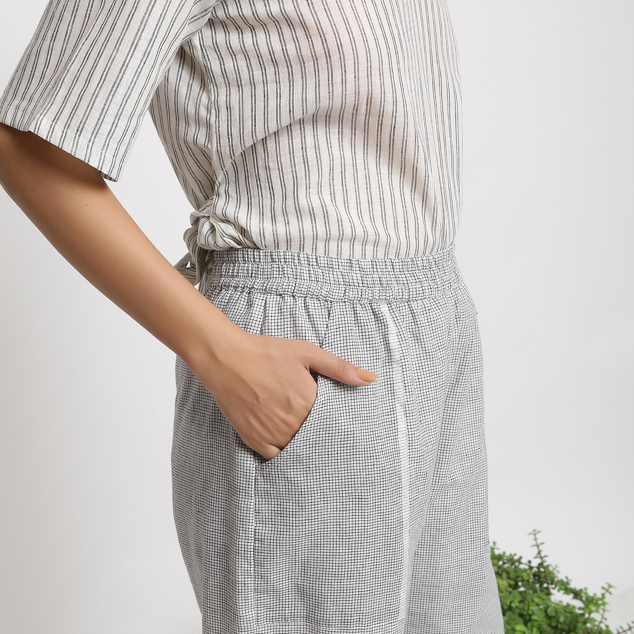 Right View of a Model wearing Checkered Handspun Pull-On Straight Fit Pant