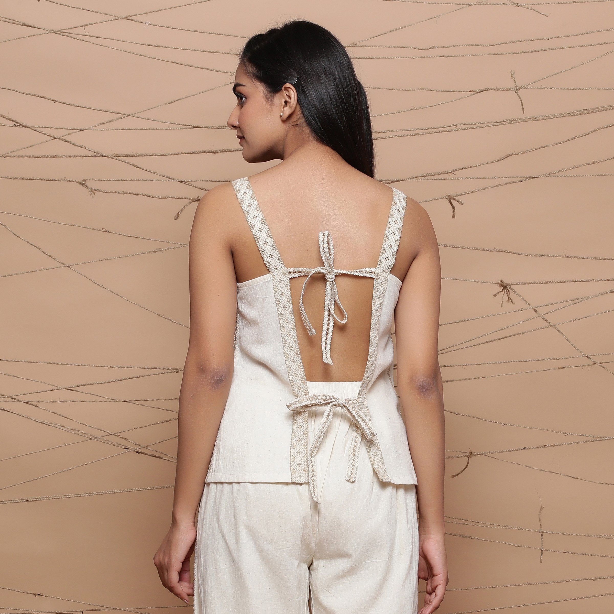 Back Detail of a Model wearing Handspun Jute Laced Tank Top and Pant Set