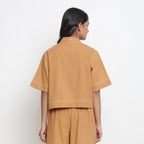 Back View of a Model Wearing Rust Vegetable Dyed Solid Handspun Shirt