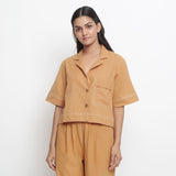 Front Detail of a Model wearing Vegetable Dyed Rust Top and Solid Pant Set