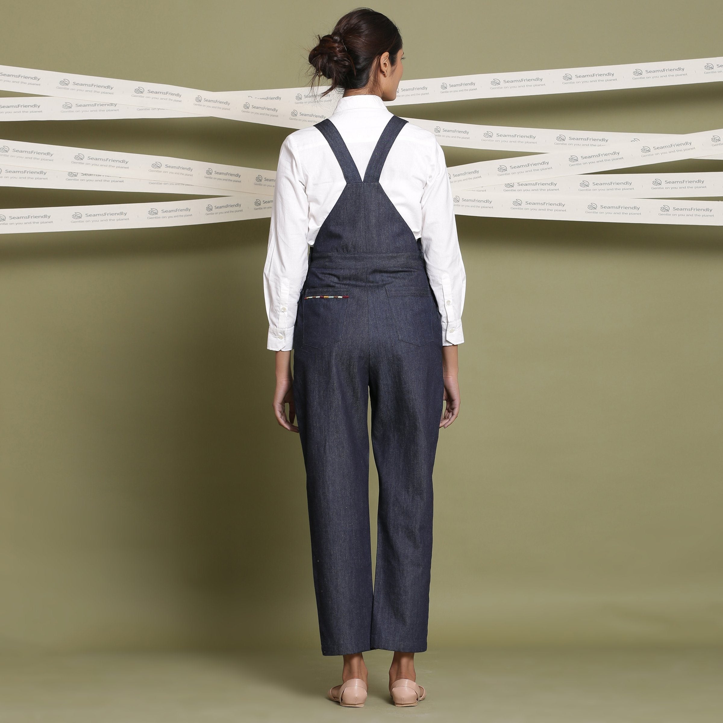 Back View of a Model wearing Classic White Shirt and Indigo Dungaree Set