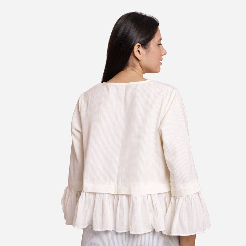 Back View of a Model wearing White Frilled Cotton Peplum Top